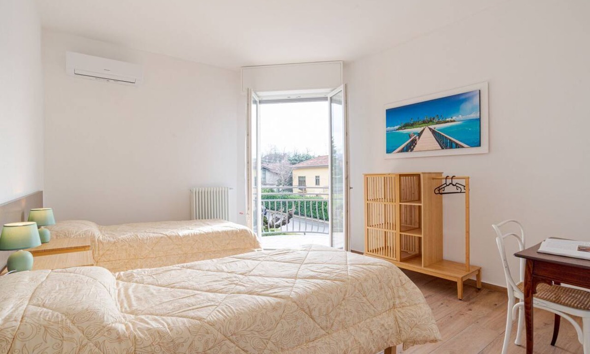 Cesana Brianza Apartment | Travel with your family and friends and explore lakes and mountains near Como!This spacious apartment, with two bedrooms, two bathrooms, open space kitchen with island, large living room, small terrace, is located on the road that connects the two main c