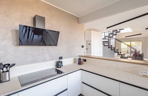 Treviglio Apartment | An elegant 198-square-meter apartment, perfect for six guests, located on the sixth floor of a modern building with an elevator (NOT accessible to people with disabilities).The property is situated in Treviglio, a town known for its lively historic cente