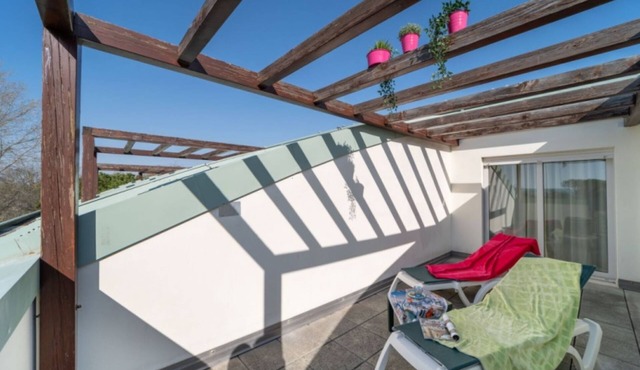 Spacious apartment on two levels with pool in Bibione Pineda