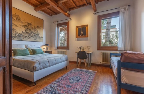 Ferrara Apartment | GuestHost - Stunning ground floor apartment in a modern villa, perfect for up to 5 people.Immersed in a charming garden with pine forest and swimming pool, the accommodation is located in a quiet residential area equipped with all services, a short dista